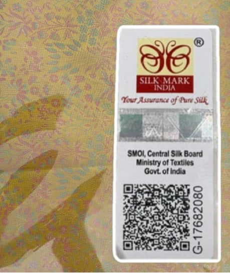 Silk Mark India label on a fabric background